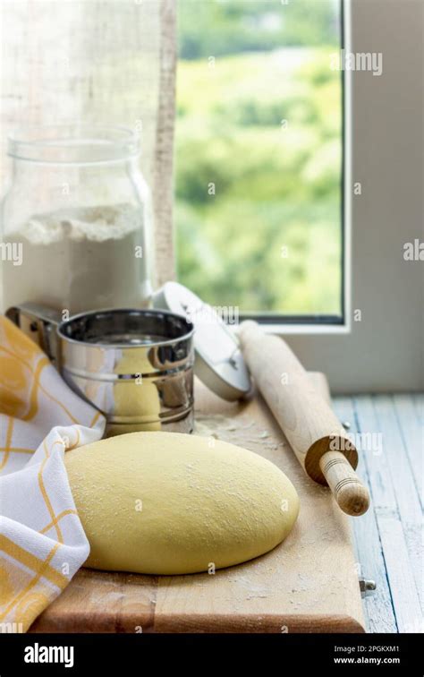 Cooking Corn Tortillas Or Buns Raw Cut Dough On A Wooden Board Against