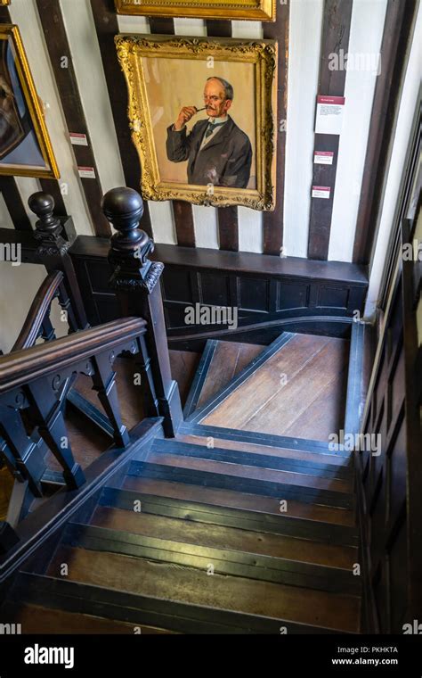 Wooden Stairway And Old Wall Paintings Inside The Historic Tudor House