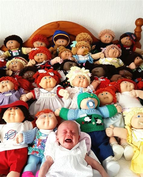 Premium Photo | Baby girl crying while lying against various dolls at home