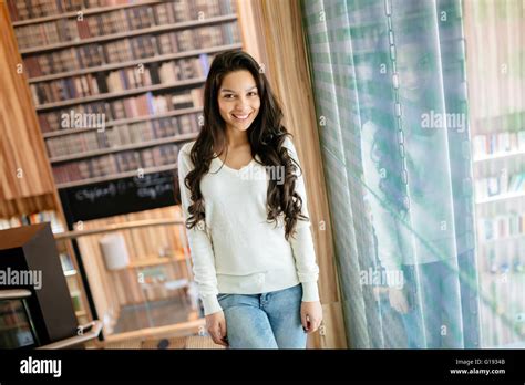 Beautiful Brunette Posing In Library Stock Photo Alamy