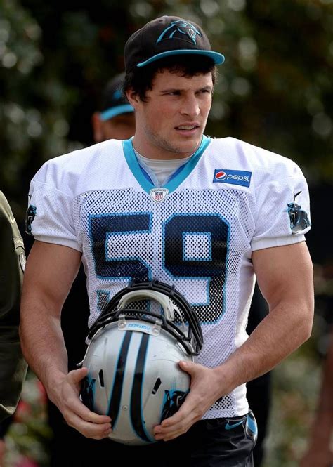 Carolina Panthers Linebacker Luke Kuechly Carries His Helmet To