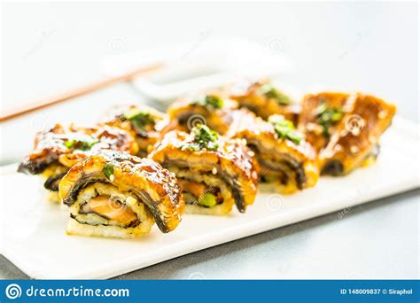 Grilled Eel Or Unagi Fish Sushi Maki Roll With Sweet Sauce Stockbild