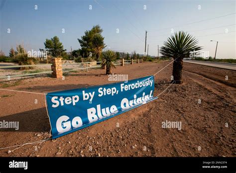 A Sign Reads Step By Step Ferociously Go Blue Origin On The Side Of