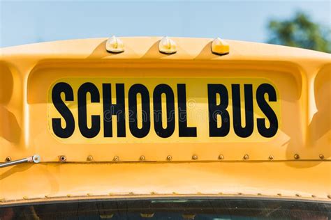 Close Up Shot Of School Bus Inscription Over Front Window Stock Photo