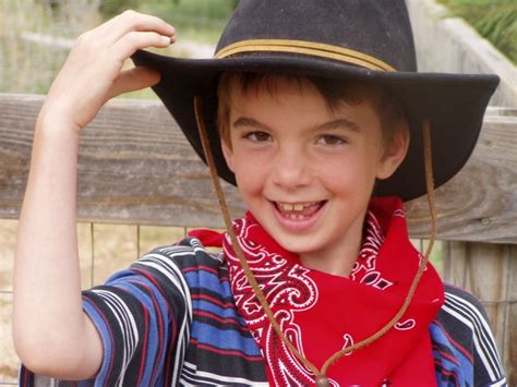 Young boy in cowboy hat and red bandana Free Stock Photo | FreeImages