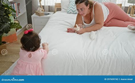 Confident Mother And Cheerful Daughter Enjoying Playtime With Toys