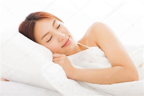 Beautiful Young Asian Woman Sleeping In The Bed — Stock Photo © Tomwang