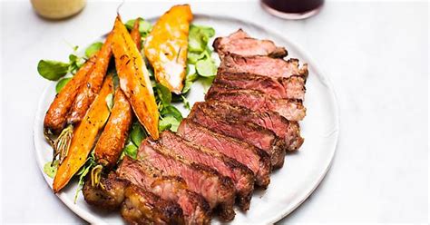 The Feast Before The Feast Seared New York Strip Steak Served With Roasted Carrots And Sweet