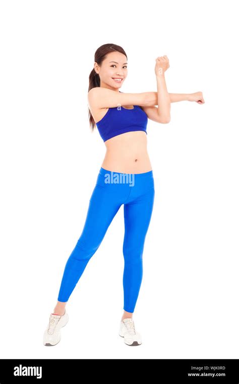 Beautiful Fit Woman Stretching Her Arm And Smiling Stock Photo Alamy