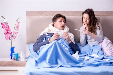 The Wife Caring For Sick Husband At Home In Bed Stock Image Image Of