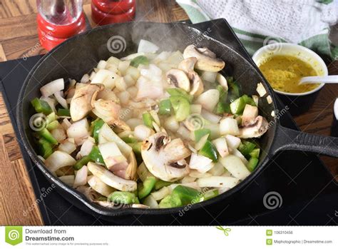 Sauteing vegetables stock photo. Image of garlic, cooking - 106310456