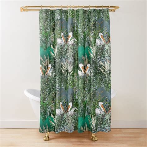 A Shower Curtain With Tropical Leaves And Birds On It In Green Tones