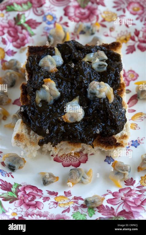 Laver Bread with Cockles on Toast - a Welsh Breakfast Delicacy Stock Photo - Alamy