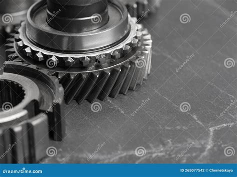 Different Stainless Steel Gears On Grey Background Closeup Space For