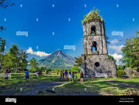 Tourists Visit The Ruins Of Cagsawa An 18th Century Franciscan Church