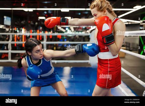 Women In Red And Blue Gloves Boxing On The Ring Box Training Female