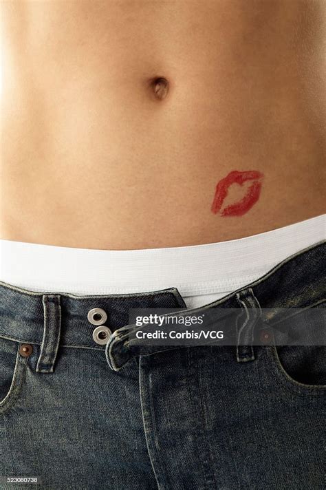 Mans Stomach With Lipstick Kiss High Res Stock Photo Getty Images