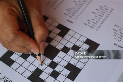 Pencil And Solves Crossword Puzzle Stock Photo Download Image Now