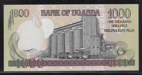 UGANDA 1000 Shillings 2003 Série QW Fast UNC MA Shops