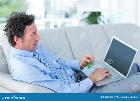 Businessman Doing Online Shopping On Couch Stock Image Image Of