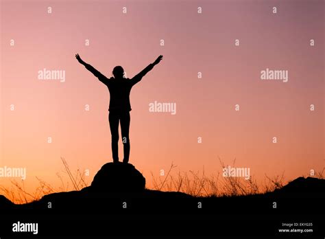 Silhouette Woman Arms Raised Against Hi Res Stock Photography And