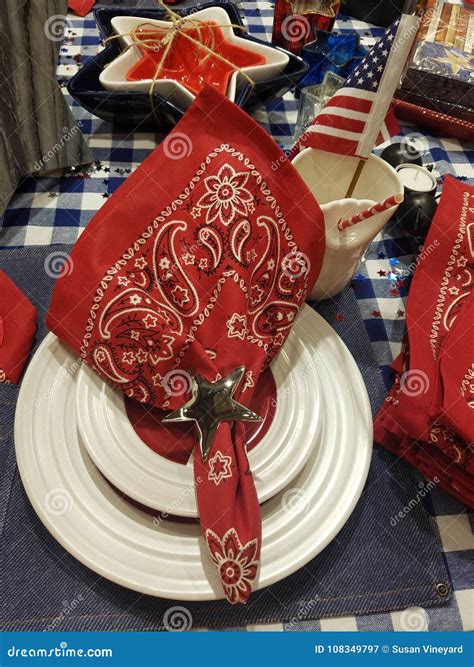 Place Setting For A Cowboy Cookout With Denium Placemats And Bandana