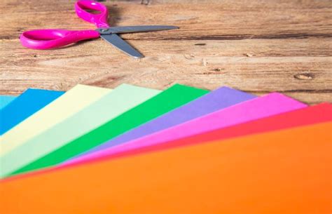 Premium Photo Colorful Papers And Scissor In Wooden Background