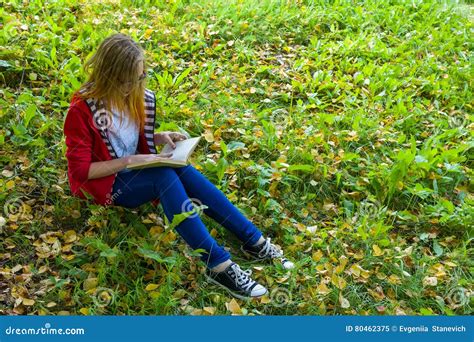 Girl Sitting On Grass And Reading A Book Stock Image Image Of Hair