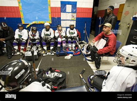 Coach Talks To Players On Youth Ice Hockey Team Stock Photo Alamy