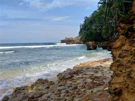 Beach with Rocks, Waves and Blue Sky. the Beautiful Sanggar Beach in ...