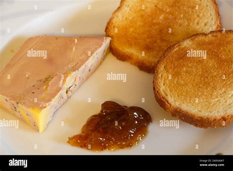 Plate of foie gras with toast and fig jam Stock Photo - Alamy