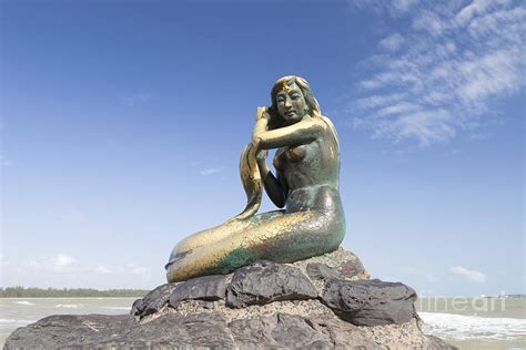 Golden mermaid statue on Samila beach Photograph by Roberto Morgenthaler