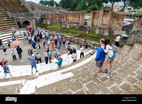 Tourists Taking Selfies At An Ancient Roman Amphitheatre Pompeii