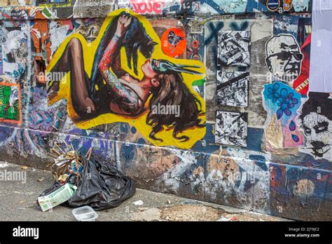 Black Bin Bag With Garbage In Front Of Urban Street Art In Briklane