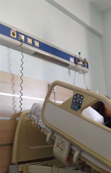 A Hospital Room With A Bed And Medical Equipment On The Wall Next To An