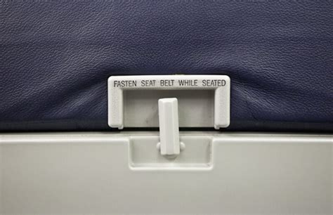 Collapsible Table And Seat Belt Warning Sign On Airplane Clippix Etc