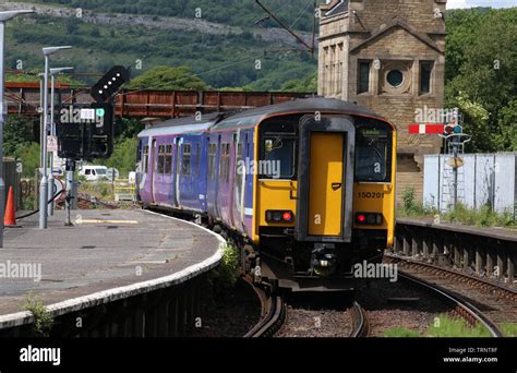 Two Car Class Sprinter Dmu In Northern Livery Leaving Platform At