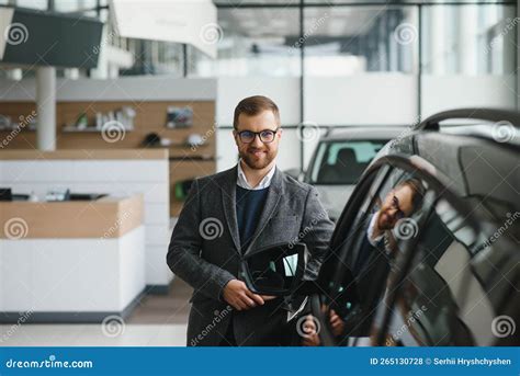 Portrait of a Handsome Salesman in the Suit Standing Near the Car in ...