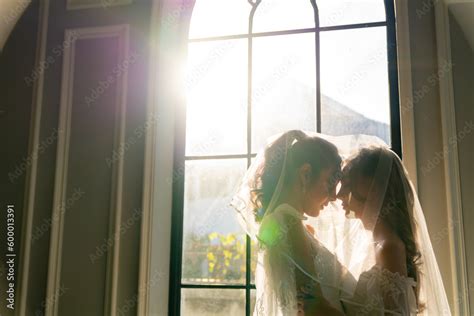 Portrait Of Beautiful Asian Woman Lesbian Couple In White Wedding Dress