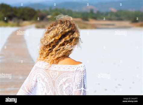 Back View Of Blonde Surf Waves Hairstyle Woman Enjoying The Beach In Summer Holiday Vacation