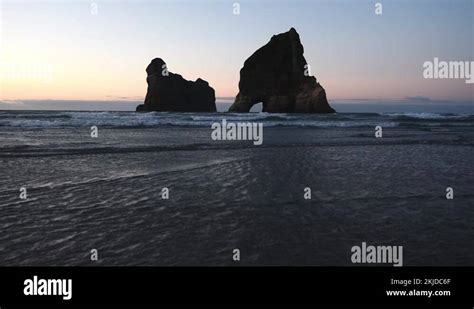 The Archway Island Rock Formation Of Wharakiki Beach New Zealand Just