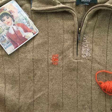 Visible Mending On A Wool Sweater With Darning Wool And Simple Darning