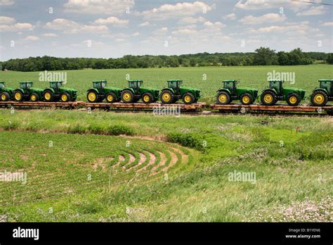 Factory Fresh Farm Tractors On Train Stock Photo Alamy