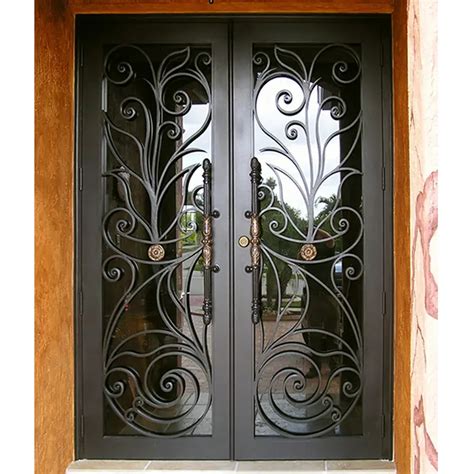 A Pair Of Black Doors With Intricate Iron Work On The Front And Side Glass Panels