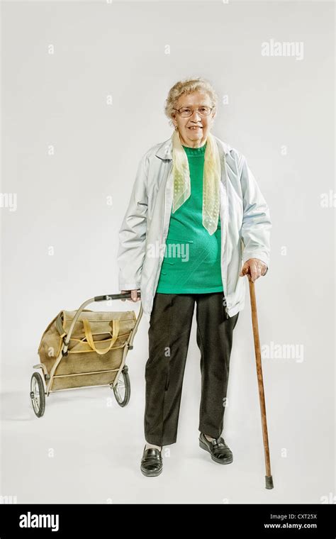 Old Woman With A Shopping Trolley Stock Photo Alamy