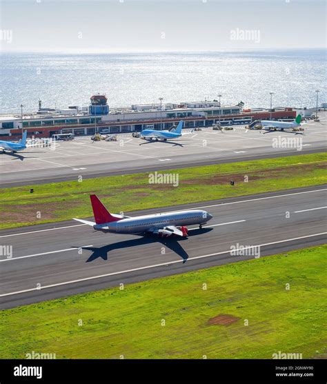 Aerial View Of Funchal International Airport With Planes By Terminal