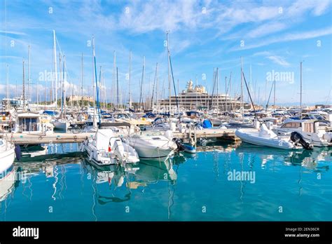 The Busy Harbor At Antibes France Filled With Boats Sailboats And