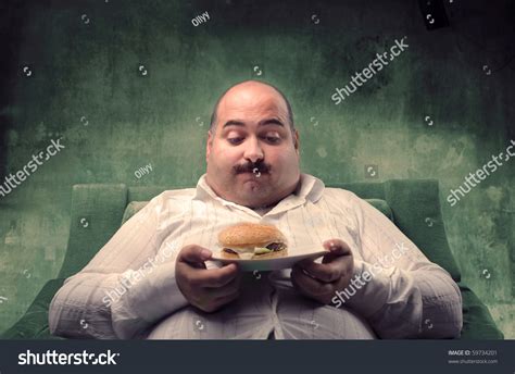 Fat Man Sitting On Armchair Looking Stock Photo 59734201 Shutterstock