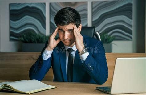 Stress And Anxiety Tired Thinking Businessman Working With Laptop In Modern Office General