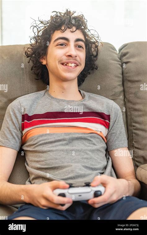 Teen playstation hi-res stock photography and images - Alamy